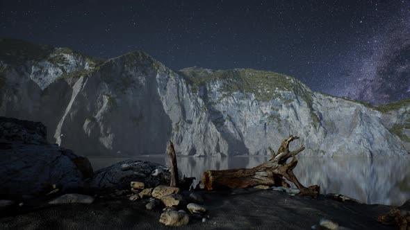 Hyperlapse of Night Starry Sky with Mountain and Ocean Beach in Lofoten Norway