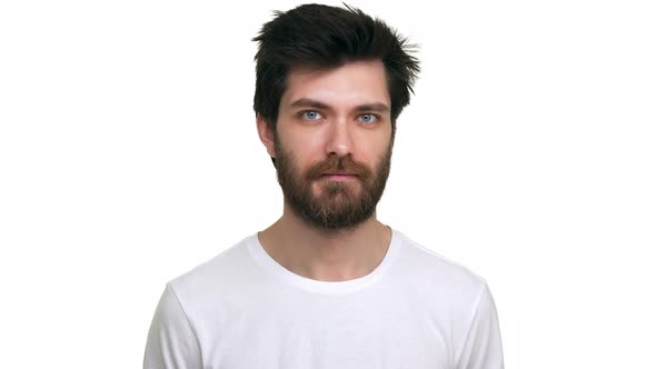 Young Male Agrees and Nodds in Surprise on White Background