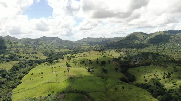 Beautiful Green Valley with Lots of Hills and Mountains Landscape View