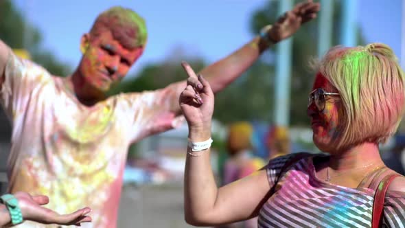Happy Young People Dance and Celebrate During Holi Festival of Colors