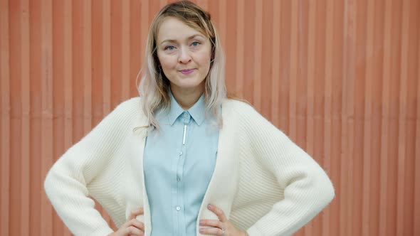 Slow Motion Portrait of Angry Woman Standing Akimbo Looking at Camera with Offended Face