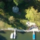 Lake Shore Top Down Drone Shot with Green Water and Boats - VideoHive Item for Sale