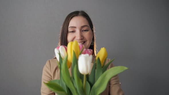 Beautiful Woman Gets Bouquet of Tulips