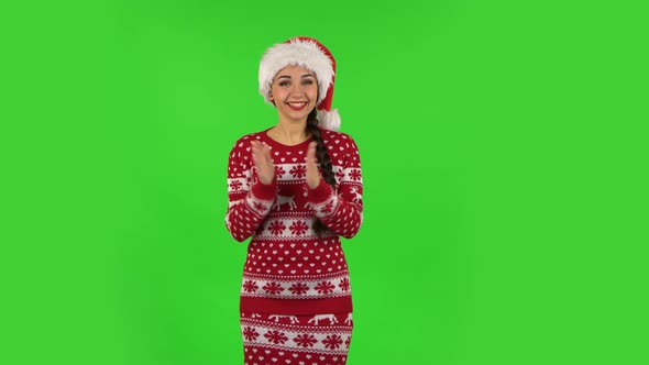 Sweety Girl in Santa Claus Hat Is Clapping Her Hands with Wow Happy Joy and Delight, Green Screen