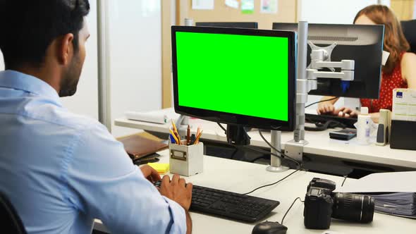 Male executive working on computer