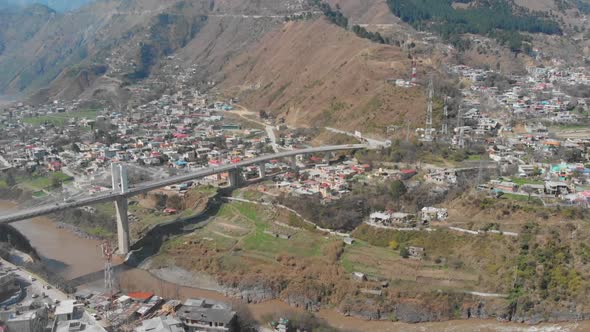 Aerial View Earthquake Memorial Bridge In Muzaffarabad Across Jhelum River. Follow Shot