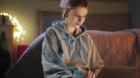 Handsome woman looking something on laptop