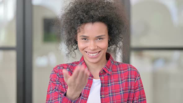 Portrait of African Woman Pointing at the Camera and Inviting