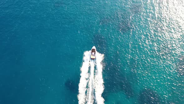 Aerial View of a Motor Boat Towing a Water Skier. Elounda, Crete, Greece