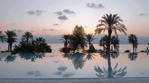 Steadicam shot of evening view near a swimming pool