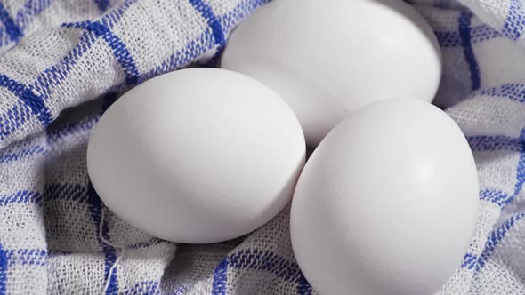 Eggs at the Table Rotation White and Fresh Chicken Eggs