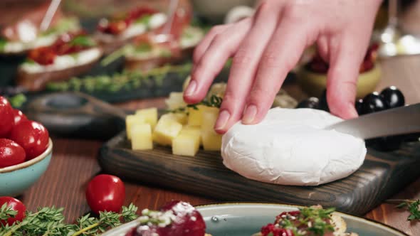 Chef Cuts Camembert Italian Cheese Spanish Brie in Traditional Restaurant Tasty Holiday Table Wine