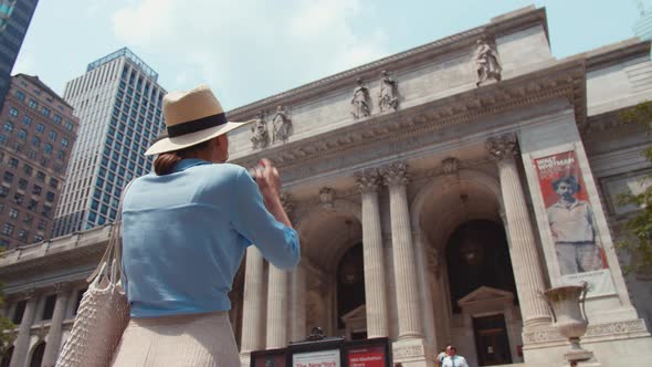 Young tourist with camera at a famous place