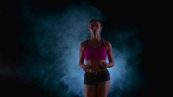 Running Sport Girl, Front View, Black Screen in the Smoke, Slow Motion