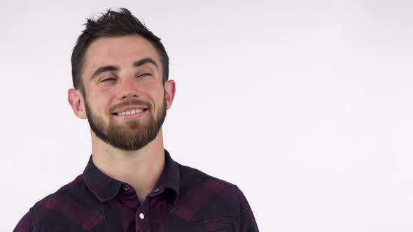 Happy Handsome Man Pointing at the Copy Space, Smiling Joyfully