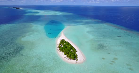 Natural aerial island view of a summer white paradise sand beach and aqua blue water background