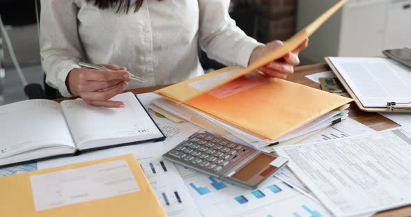 Woman Secretary Sorting Post Letters at Table in Office Closeup  Movie