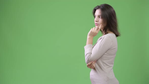 Profile View of Young Beautiful Woman Thinking