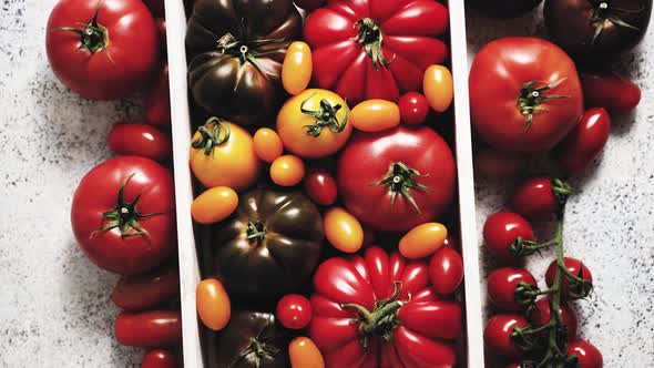 Assortment of Tomatoes in a Wooden Box