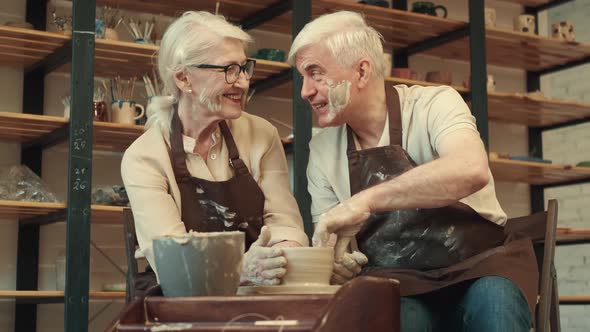 Happy Seniors Woman and Man During Pottery