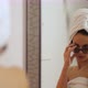 Young attractive woman with bath towel on her head and sunglasses for fun is dancing - VideoHive Item for Sale