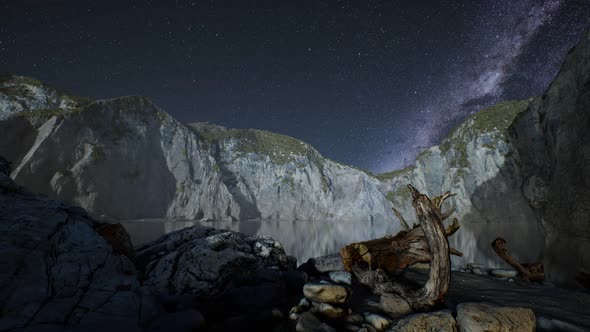 Hyperlapse of Night Starry Sky with Mountain and Ocean Beach in Lofoten Norway