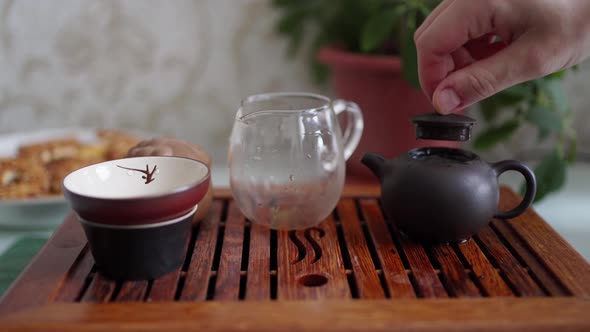 Tea Ceremony Tea Brewed in a Small Teapot is Poured Through a Funnel Saturating It with Oxygen to