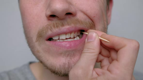 Man Using Toothpick