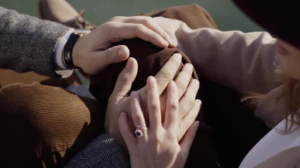 Slow motion shot of young couple holding hands in Venice