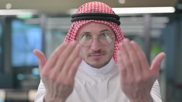 Middle Aged Arab Man Pointing at Camera, Inviting