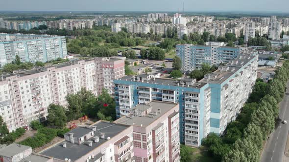 Aerial View MultiStorey Buildings Near Green Forest in Residential Area at City