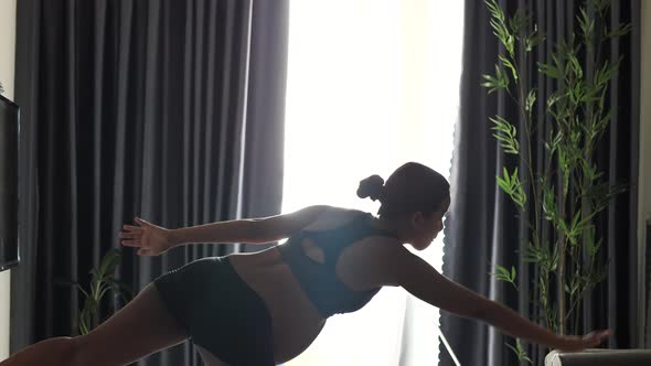 Young Pregnant Woman on Third Trimester Doing Exercise Indoor at Home