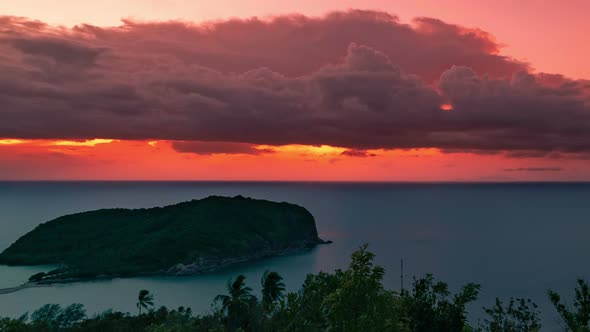 Scenic View Landscape Of Tropical Island Coast At Orange Sunset Over Beautiful Sea