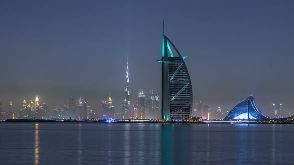 Skyline of Dubai By Night with Burj Al Arab From the Palm Jumeirah Timelapse