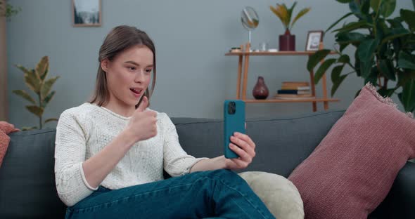 Crop View of Woman with Hearing Loss Communicating on Smartphone and Usign Sign Language