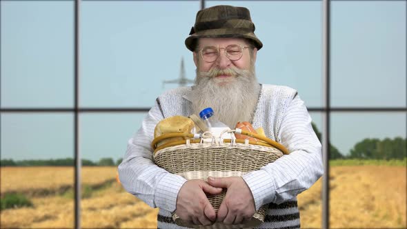 Farmer Holding Dairy Products on Blue Sky Background