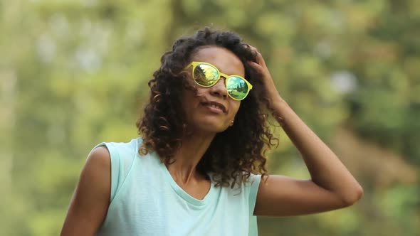 Good-Looking Multiracial Female Enjoying Music at Festival, Making Dance Moves