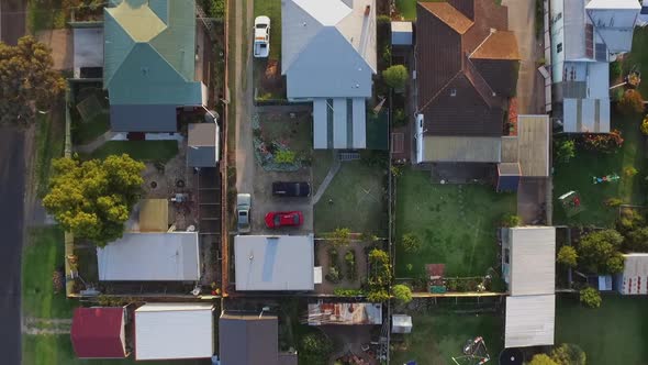 Drone aerial view top down of houses in small rural town Maffra, Victoria Australia. Sunset golden h