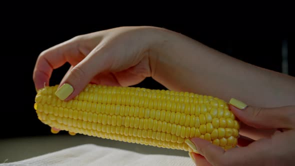 Women's Hands Twist Golden Corn Macro in Detail