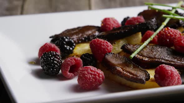 Rotating - smoked duck bacon with grilled pineapple, raspberries, blackberries and honey - FOOD 100