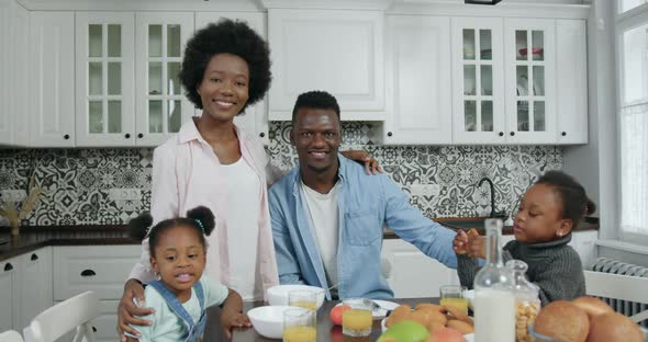 Modern Young African American Family Posing on Camera with Satisfied Faces