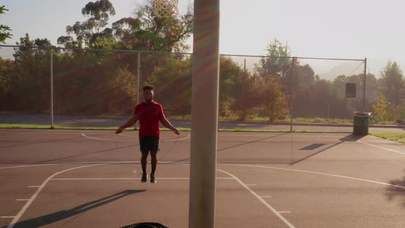 Aerial shot of a man working out with a jump-rope