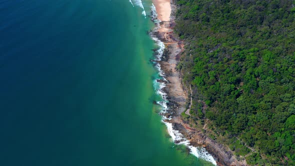 Aerial View Of Foamy Waves Breaking On The Rocky Shore At Noosa National Park Near Noosa Heads In Qu