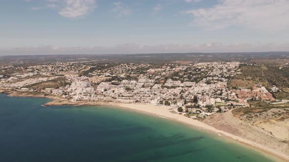 Sprawling beach town of Praia da Luz by the Atlantic Ocean and beach. Panoramic aerial view