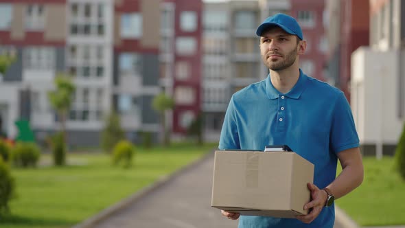 Blue Delivery Man Send a Package to Customer on Before Deliver Cargo