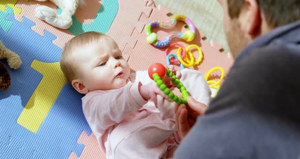 Father playing with his baby boy 