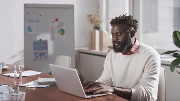 African American Businessman Using Laptop