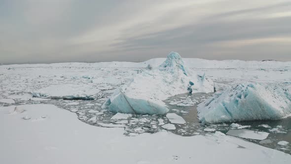 Aerial View of the J Kuls Rl n Glacial Lagoon and Floating Icebergs. The Beginning of Spring in