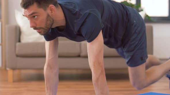 Man Doing Running Plank Exercise at Home