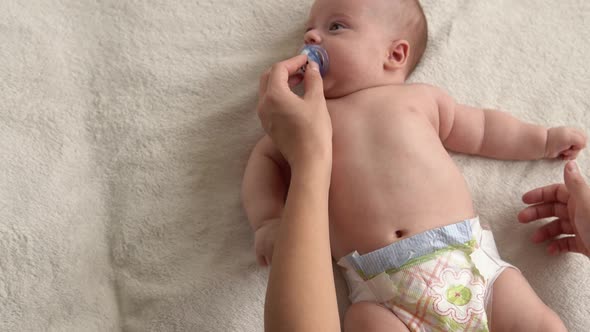 Health Skin Care Development Pediatrics Infant Closeup Mother Hands Give Naked Newborn Baby Child